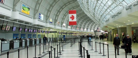 PREMIUM -- Travellers walk through Terminal 3 at Pearson International airport in Toronto on April 5, 2004. Opened in 1991, Terminal 3, combined with the new Terminal 1, will have the capability of serving 50 million passengers annually. (CP PHOTO - Steve White)
